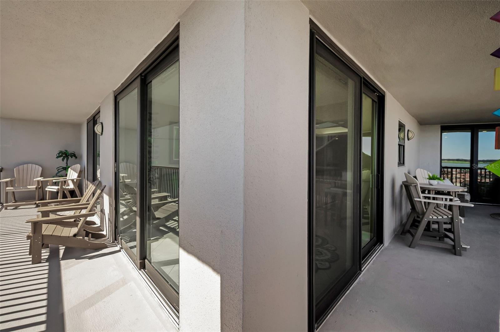 Wraparound balcony showing the angle from the Living area through the Kitchen & off the Primary bedroom