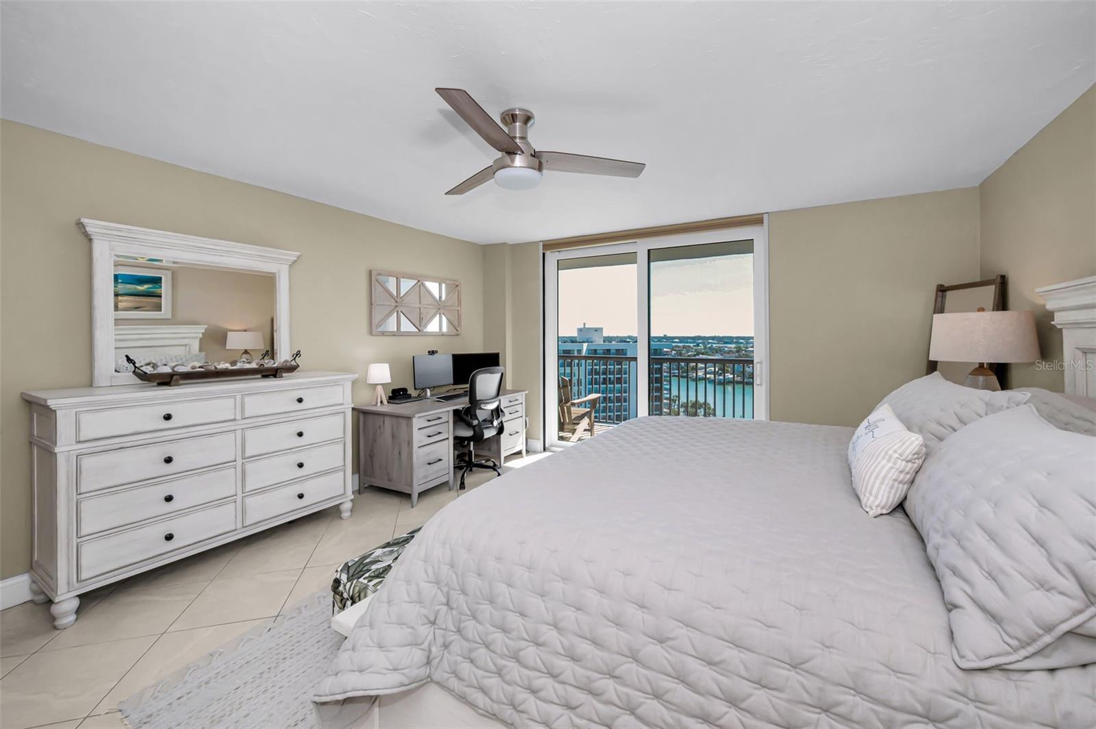 Generously sized primary bedroom offering direct, private access to the balcony