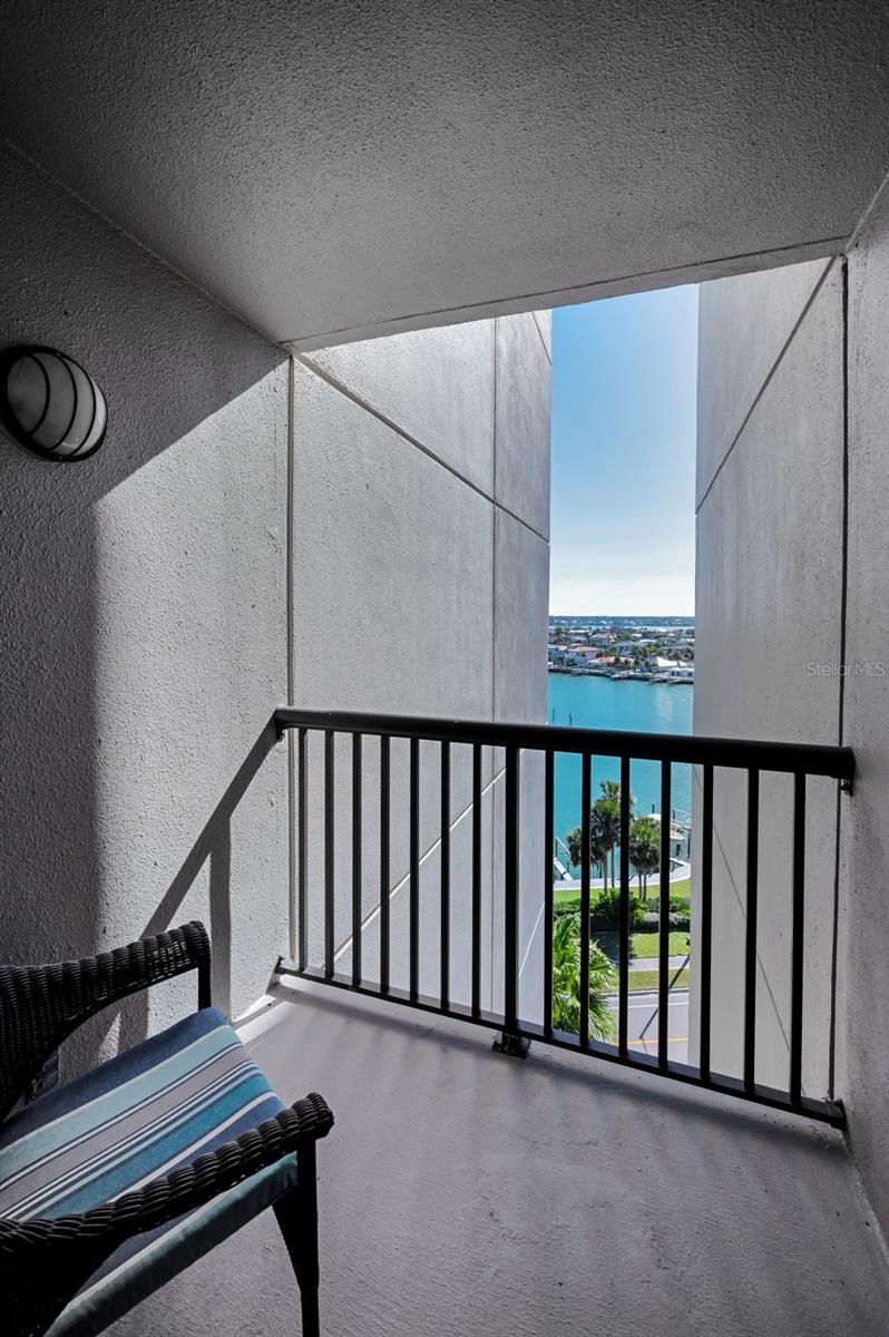 Intimate, waterfront balcony off the second bedroom sitting area