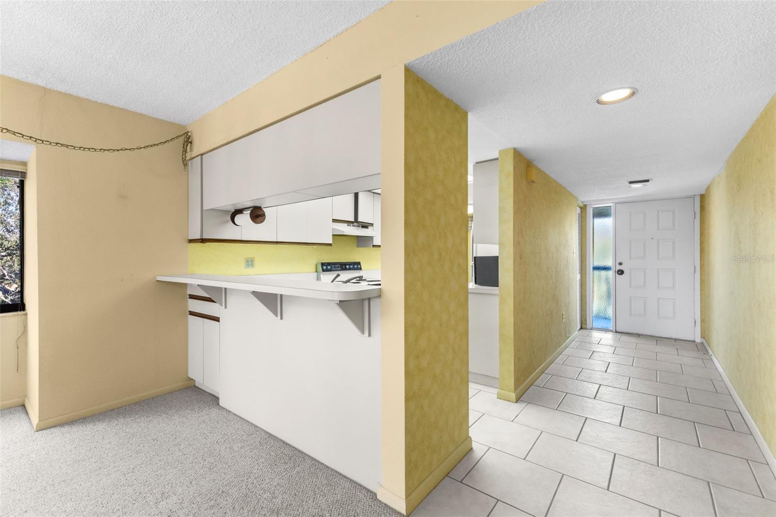 Kitchen Breakfast Bar into Great Room