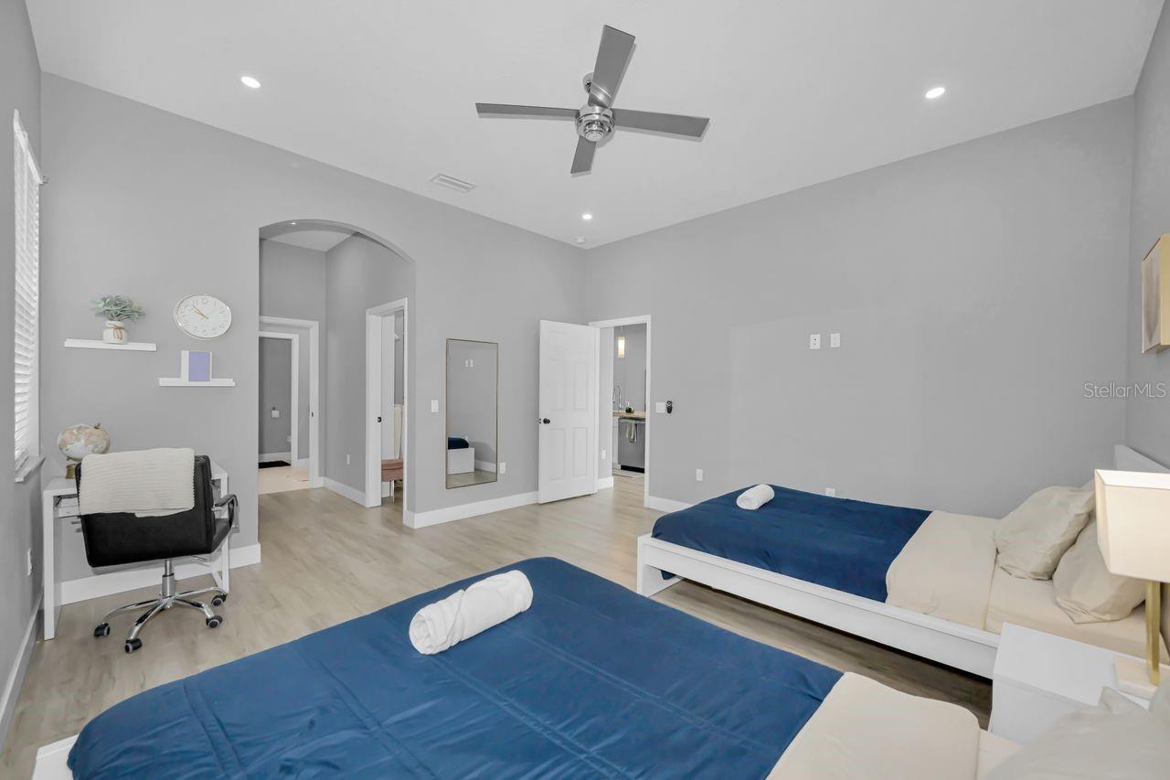 Looking towards primary bath on the left and kitchen to the right