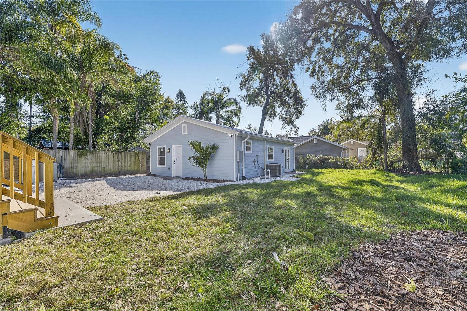 Left side showing decking to exit main house and back yard