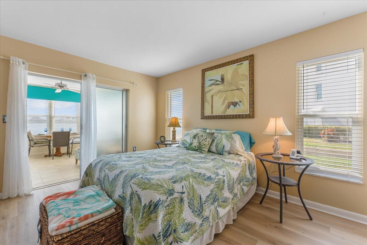 Primary bedroom off the dining room with access to Florida room