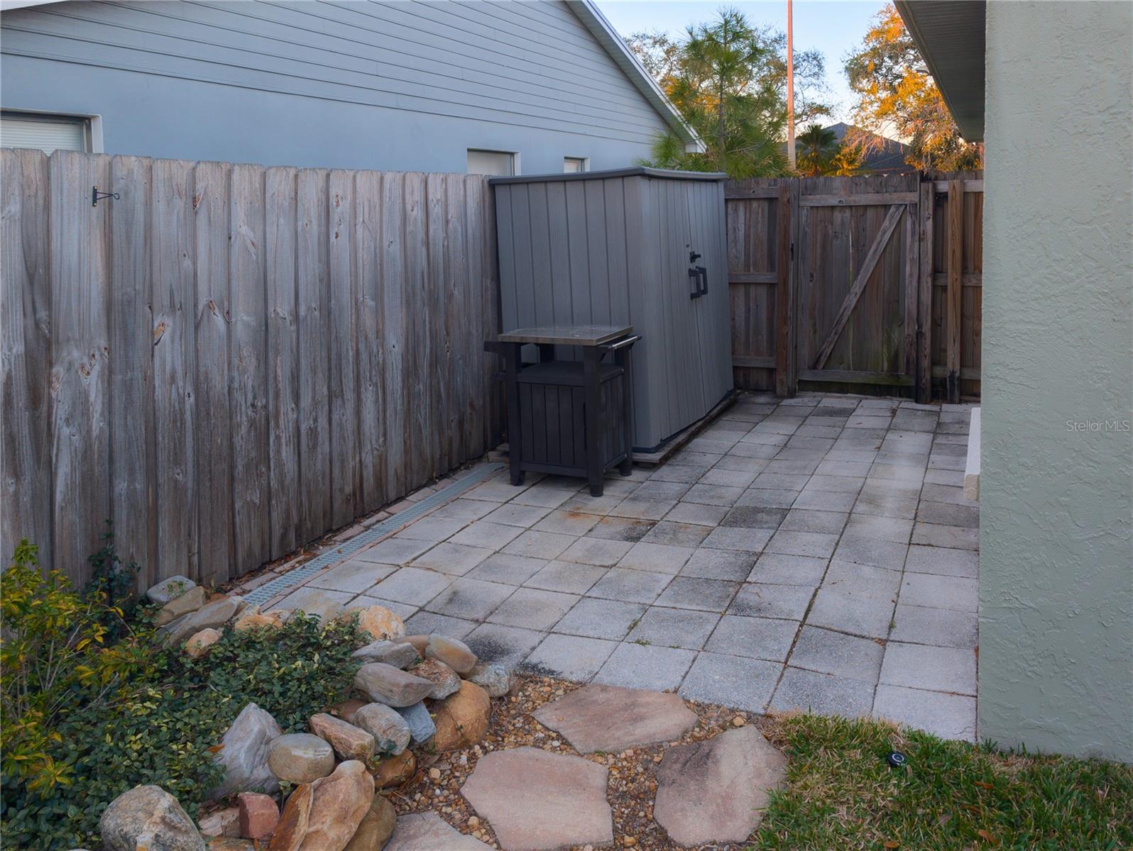 Side of home in backyard, west side