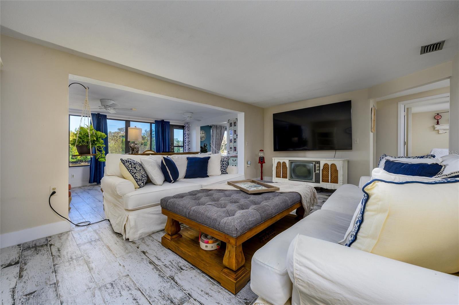 Living room seeing the curtains open in Sunroom