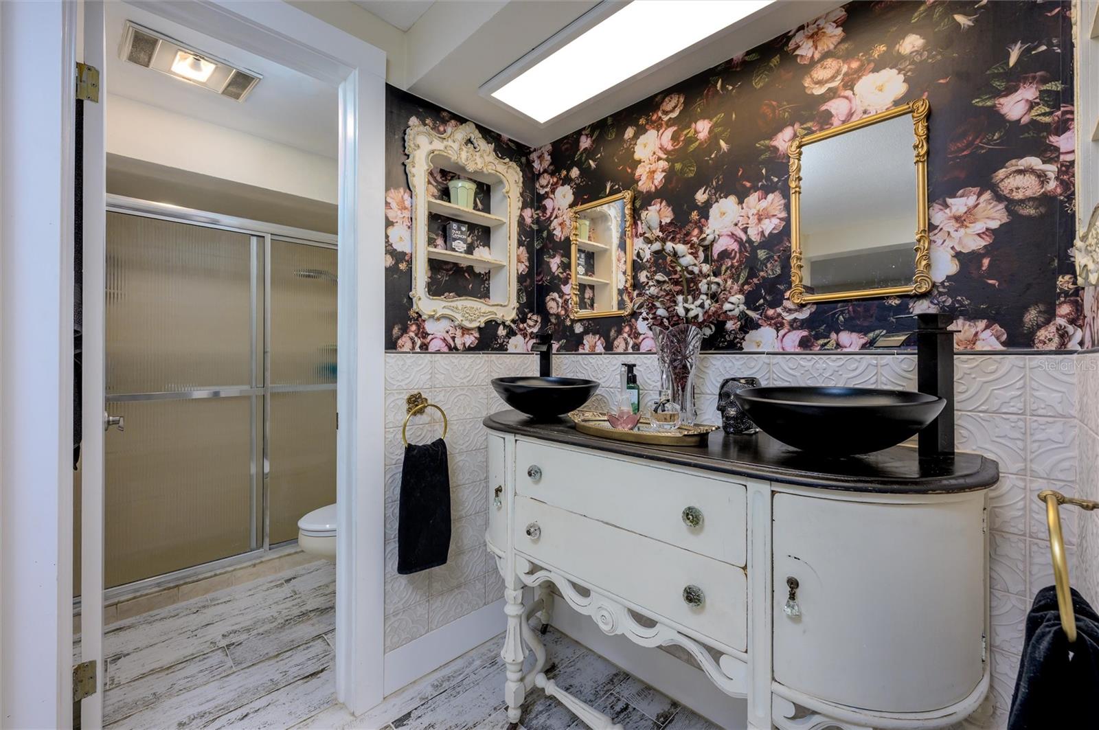 Primary Bathroom Vanity showing Shower and watercloset