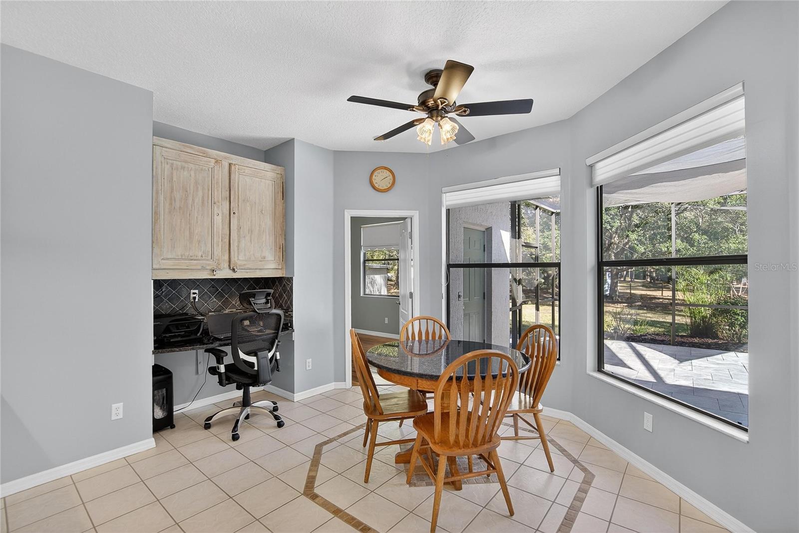 Breakfast area with customgranite breakfast table conveys