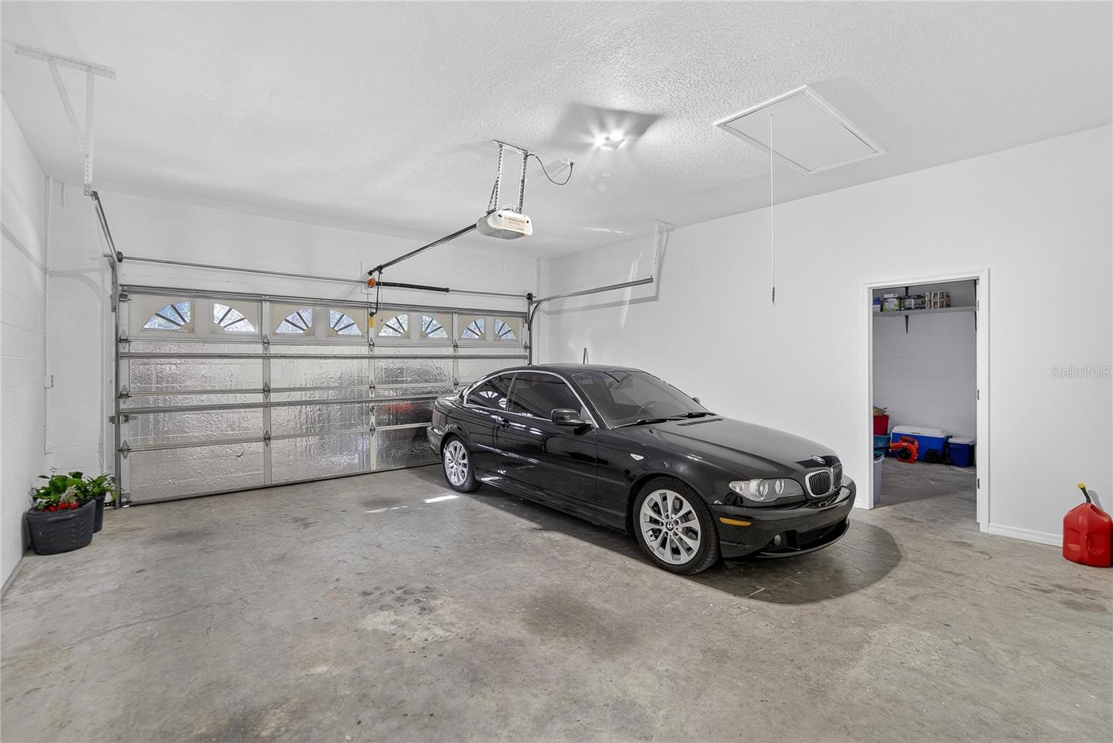 Attached 3 car garage with attic storage.
