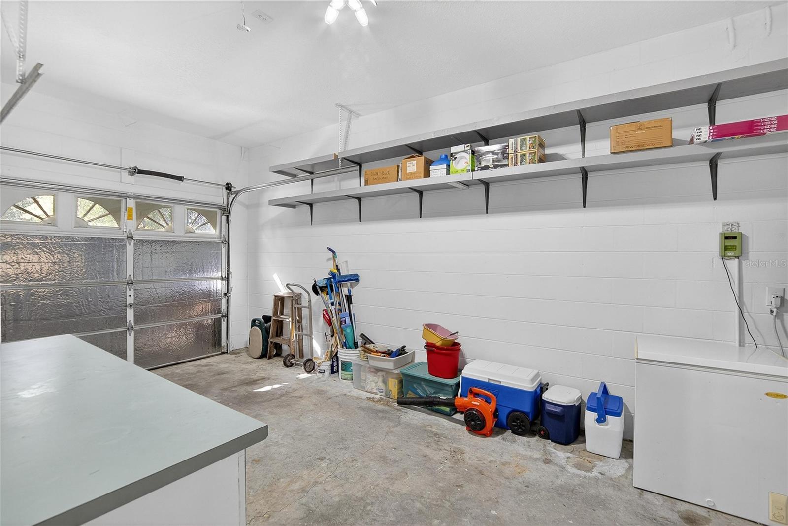 Attached 3 car garage with attic storage.
