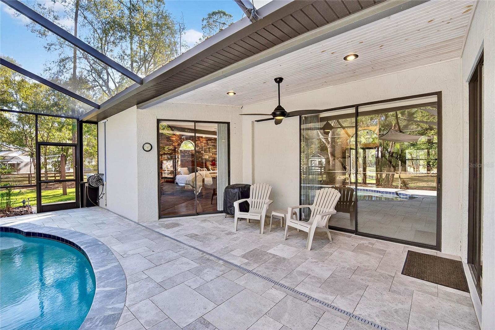 Newly remodeled pool and patio with leathered marblepavers.