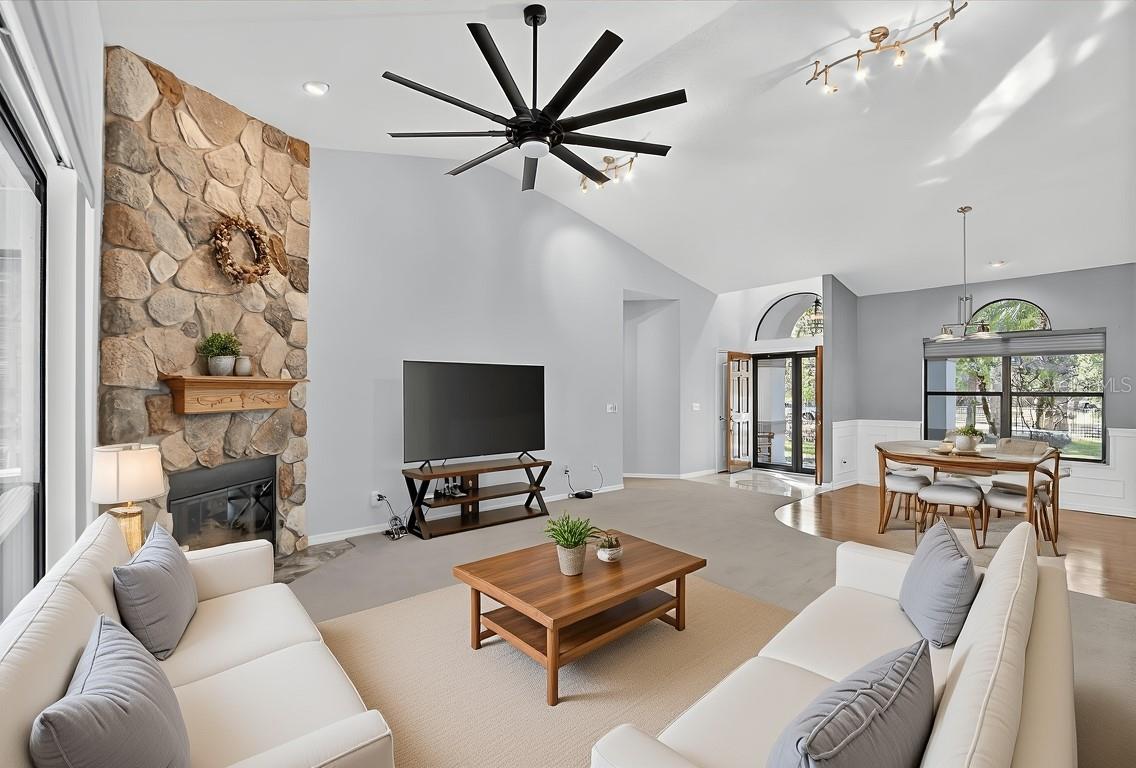 living room with fieldstone gas fireplace