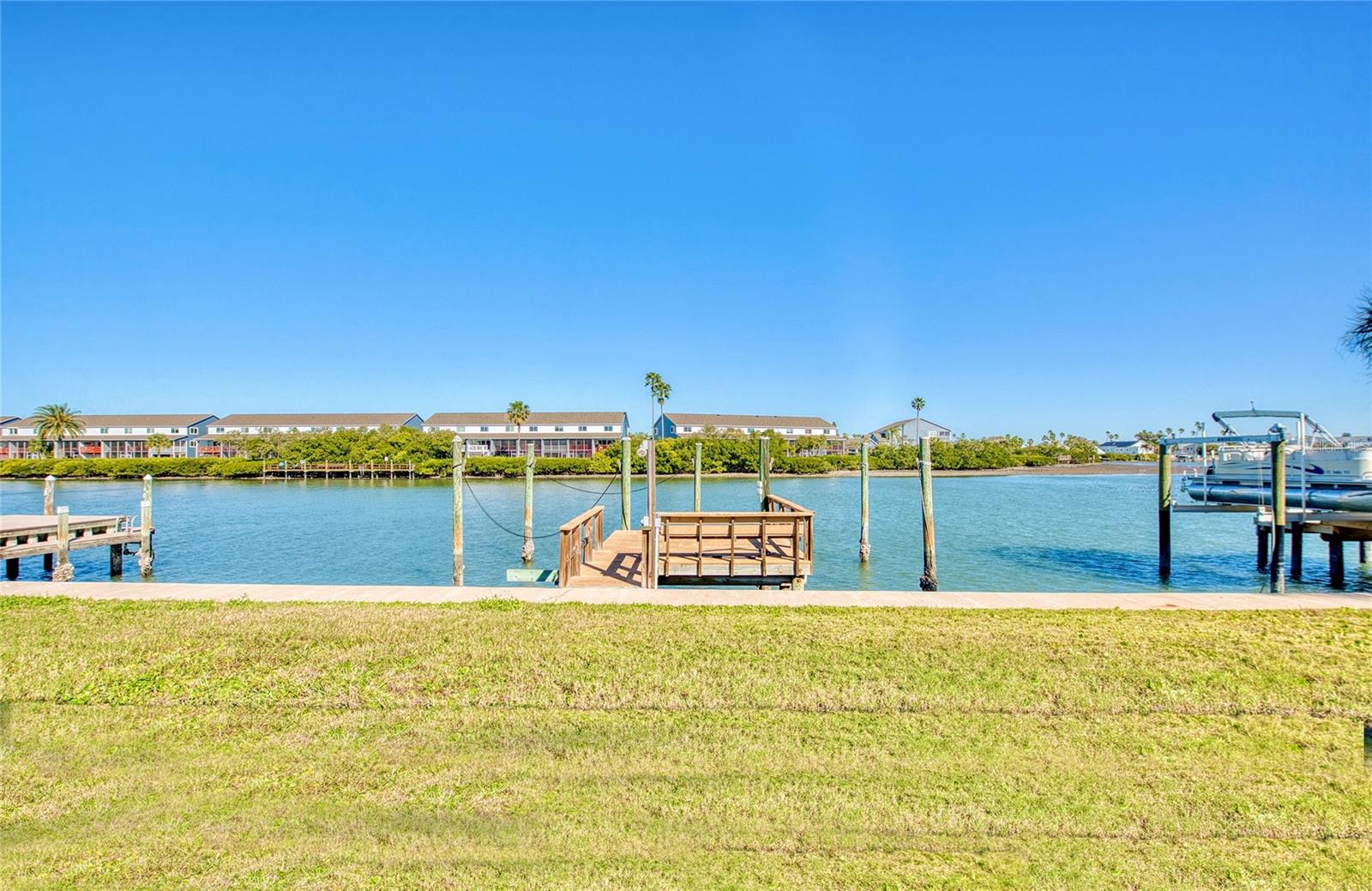 Backyard view offers plenty of privacy across the waterway.