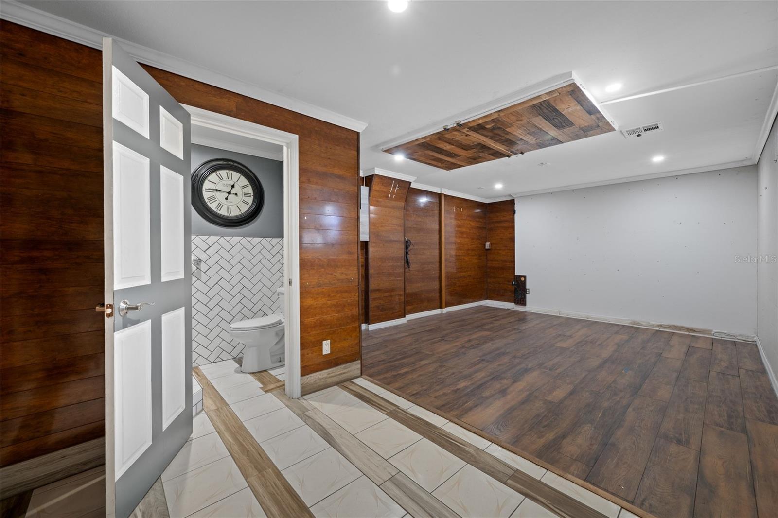 Primary Bedroom with Full Bath via Converted Garage.