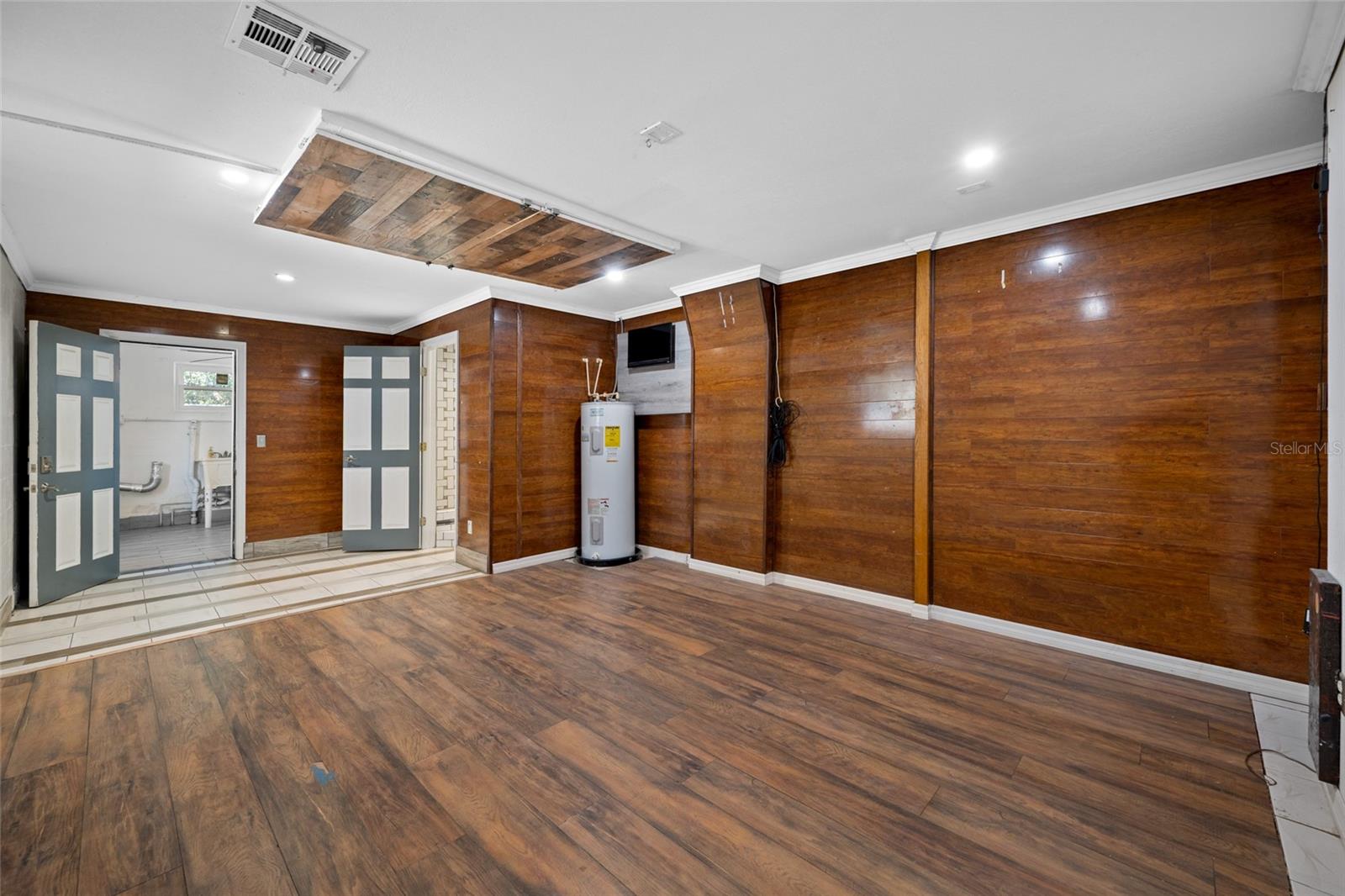 Primary Bedroom with Full Bath via Converted Garage.