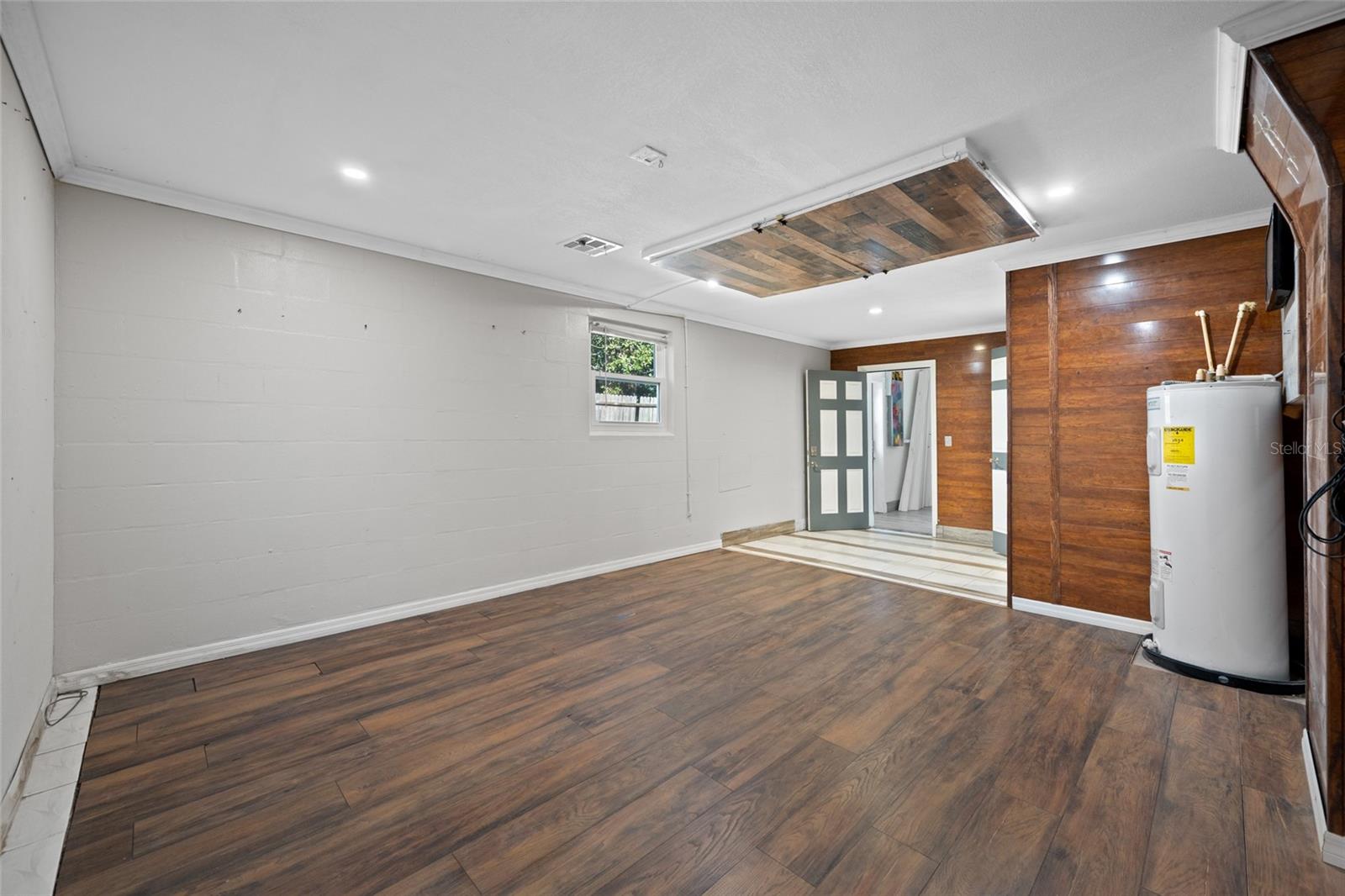 Primary Bedroom with Full Bath via Converted Garage.