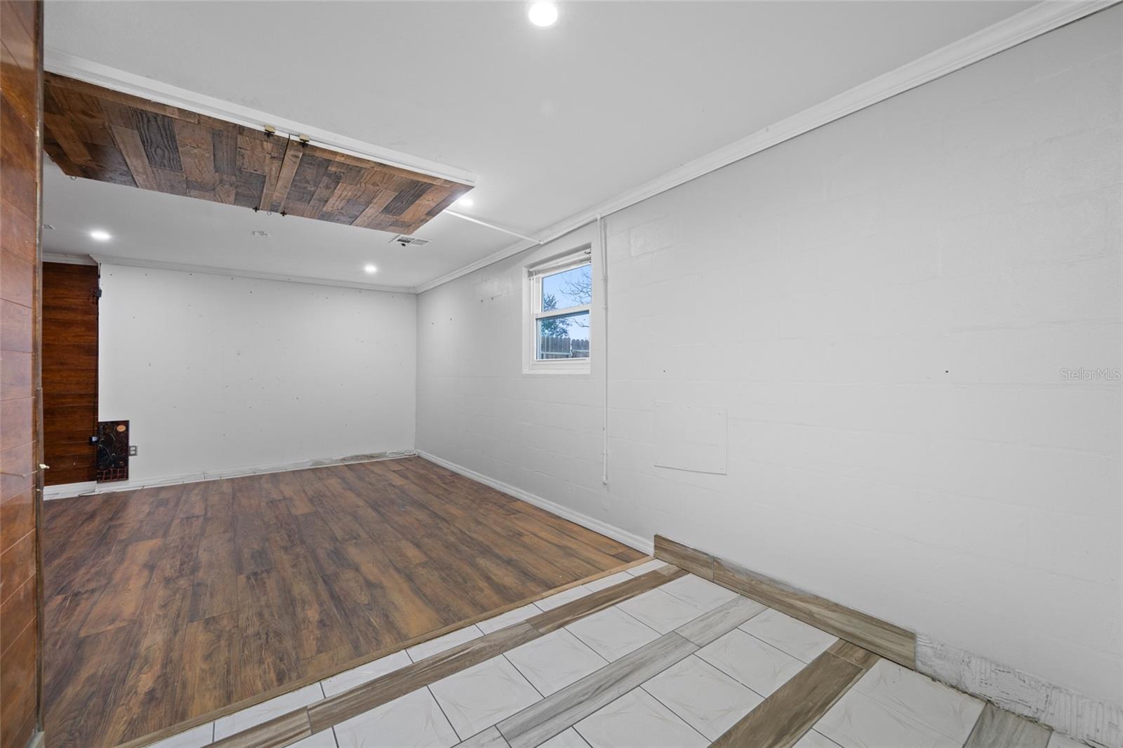 Primary Bedroom with Full Bath via Converted Garage.