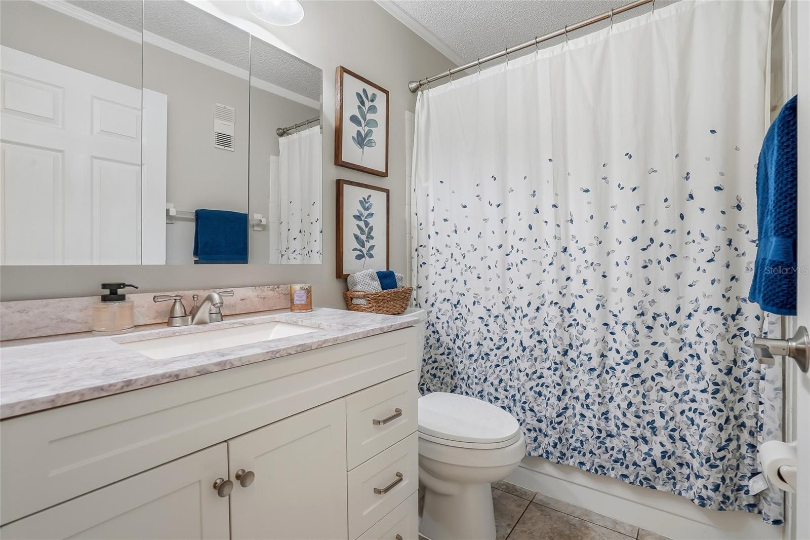 Hall bathroom adjacent to the second bedroom.