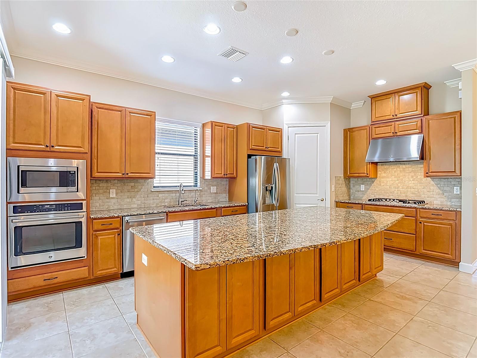 The kitchen is spacious and bright