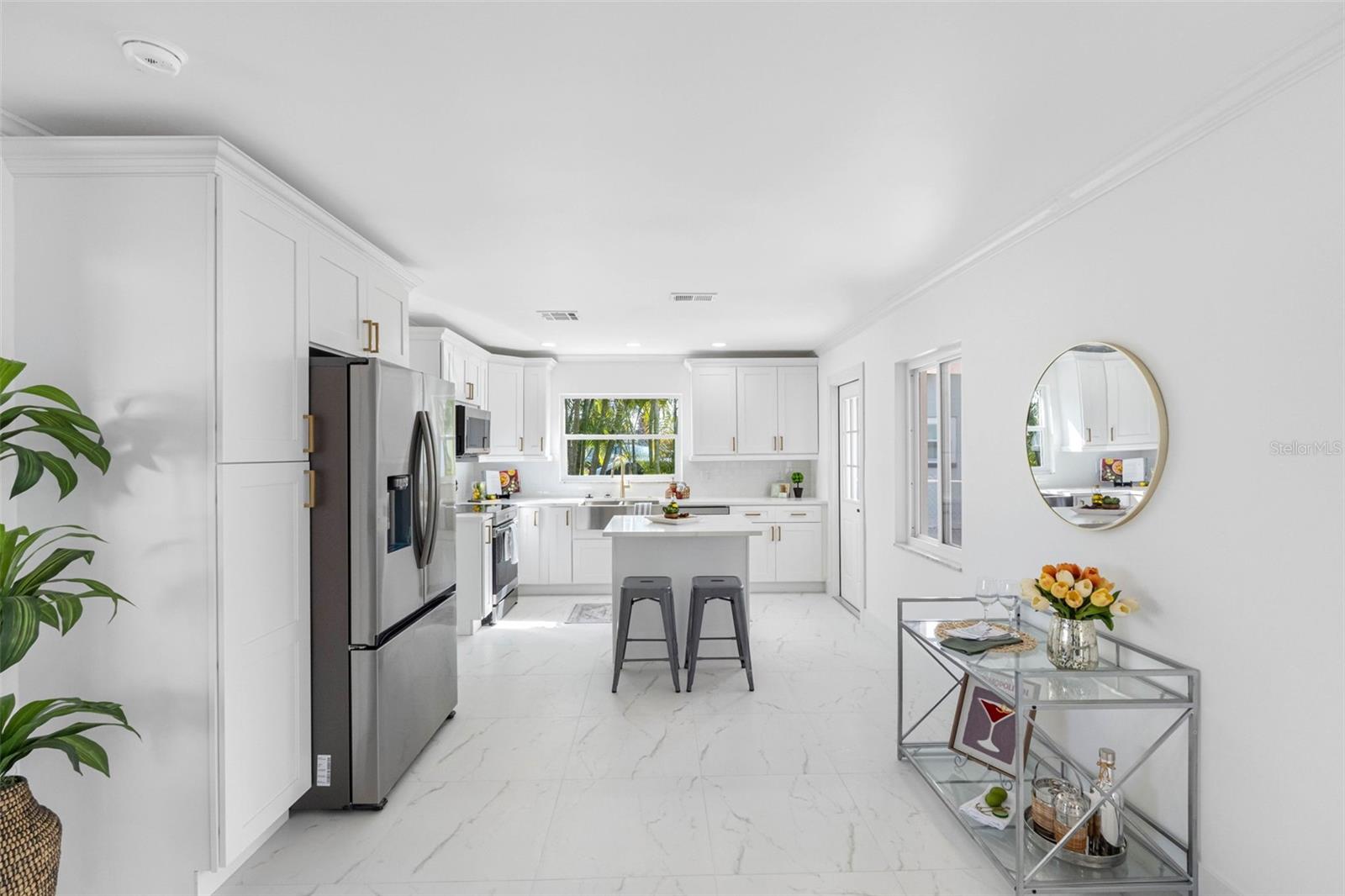 Brand new kitchen connects to the living area.