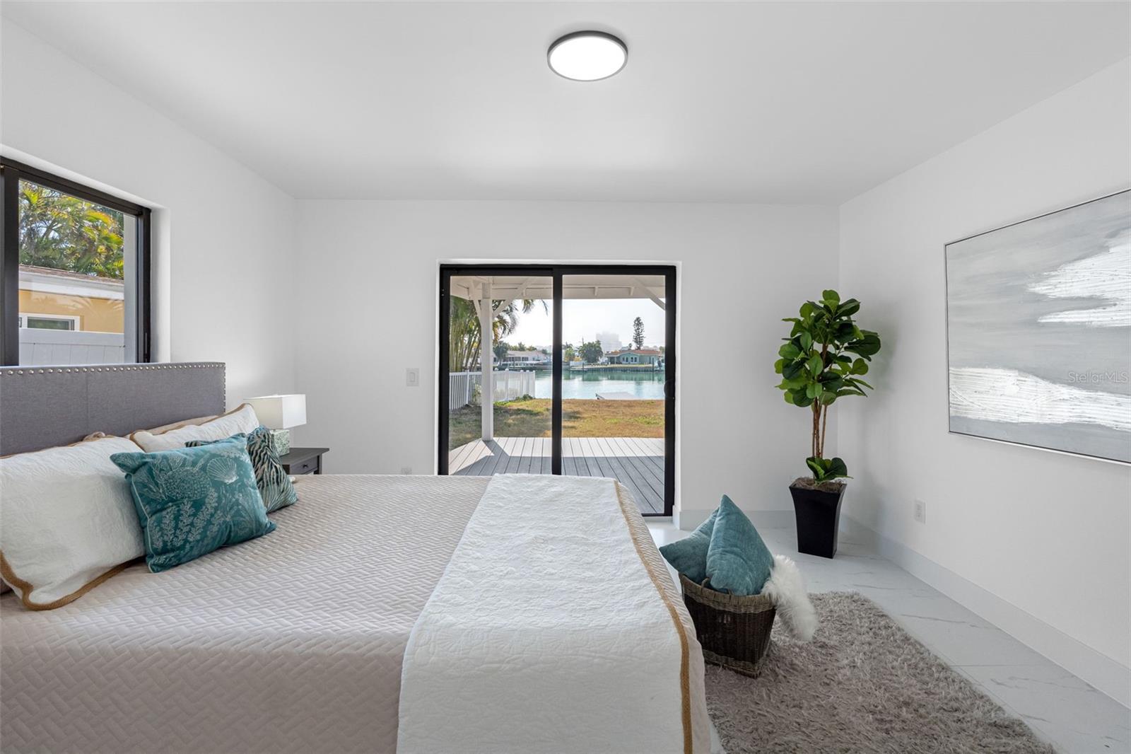 Primary bedroom opens to a covered porch.