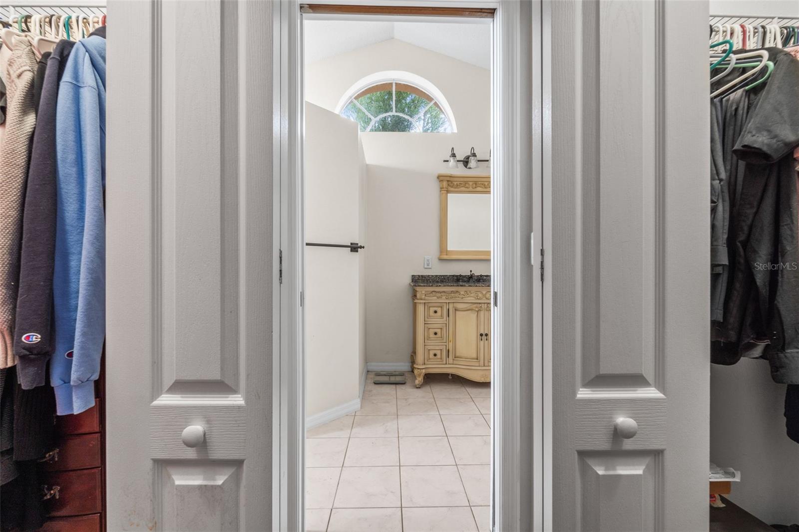 Primary room into primary bathroom