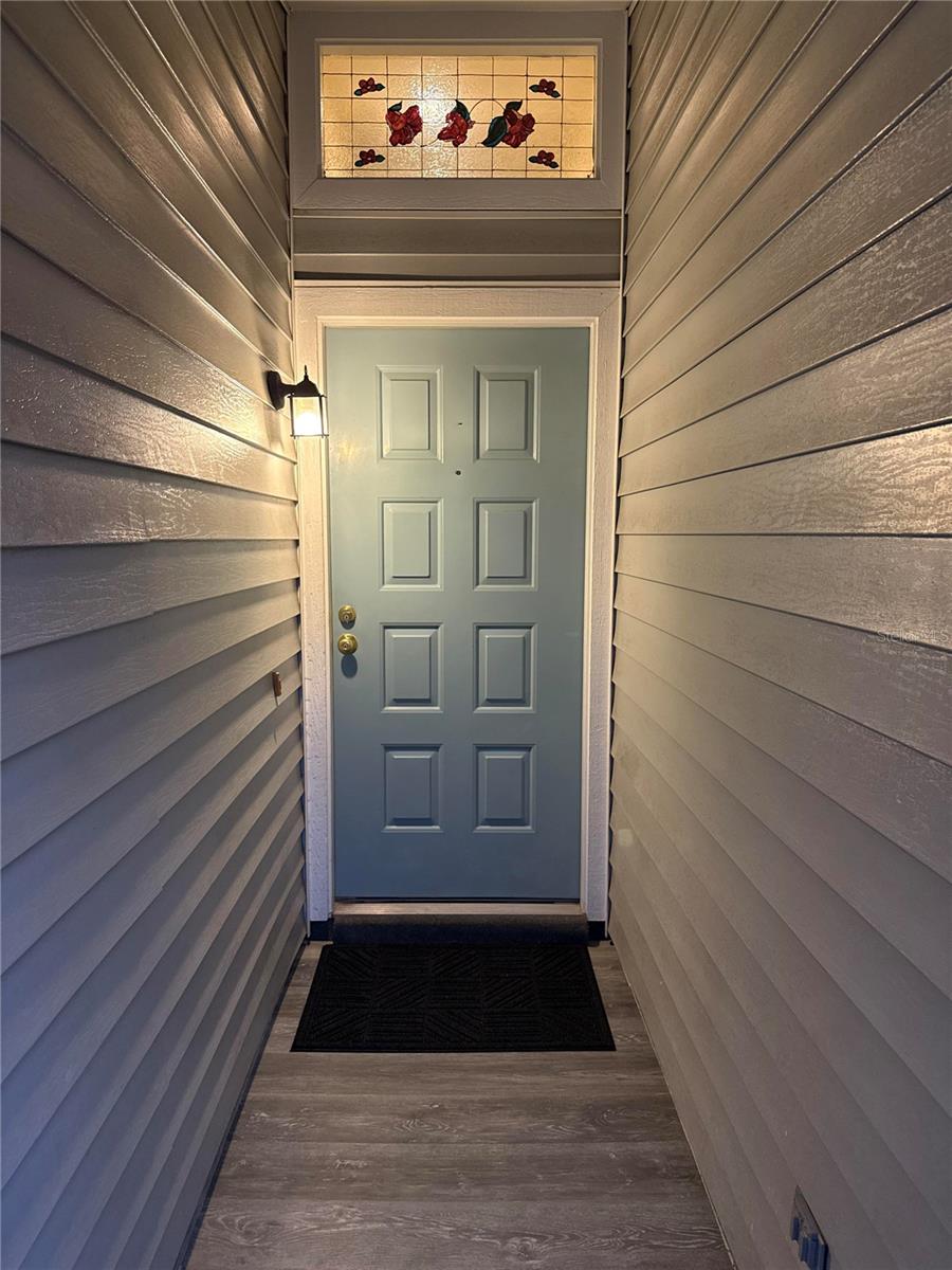 New Entryway Flooring and Fresh painted door!