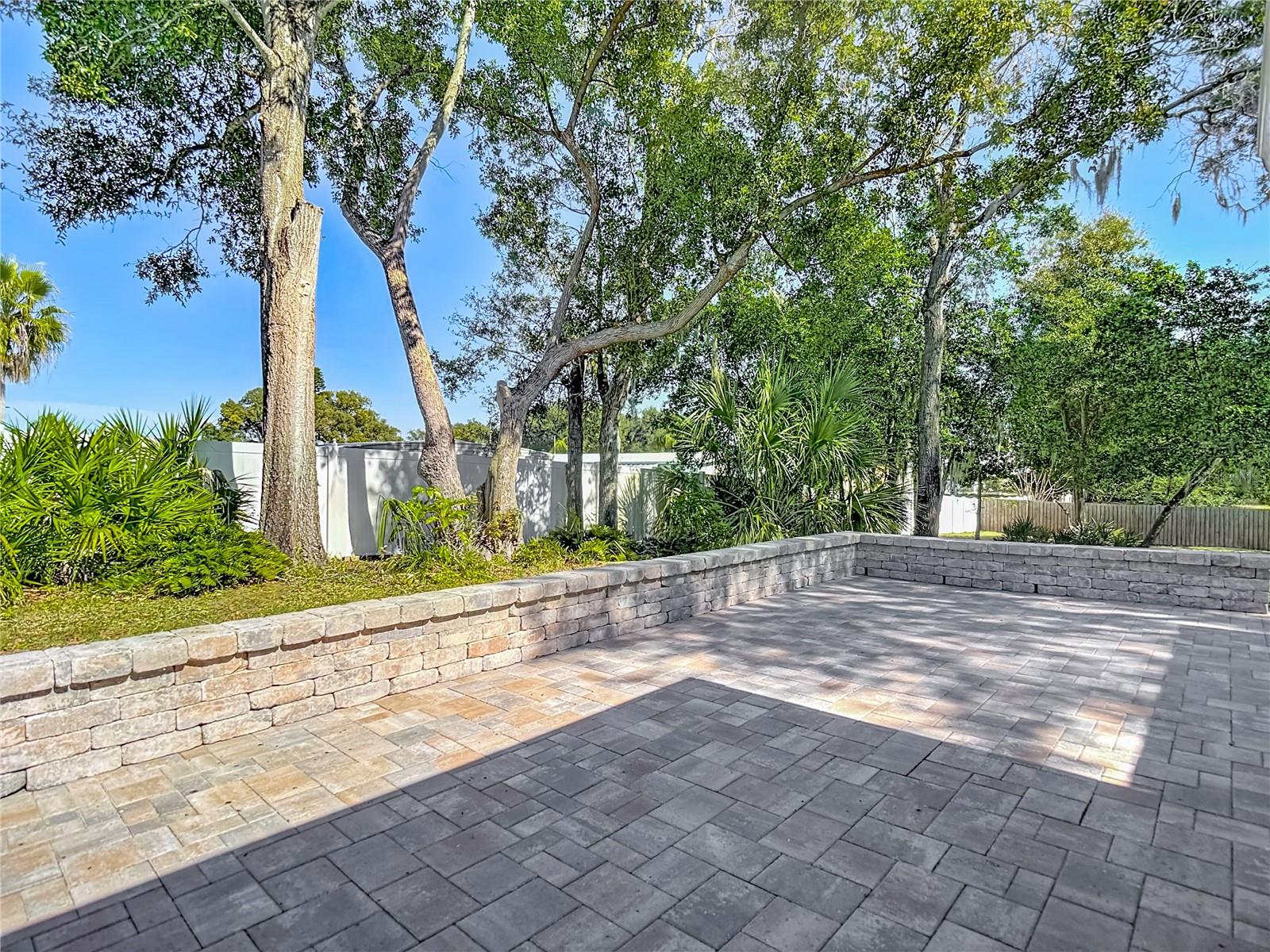 Huge paver courtyard in the rear of the home!