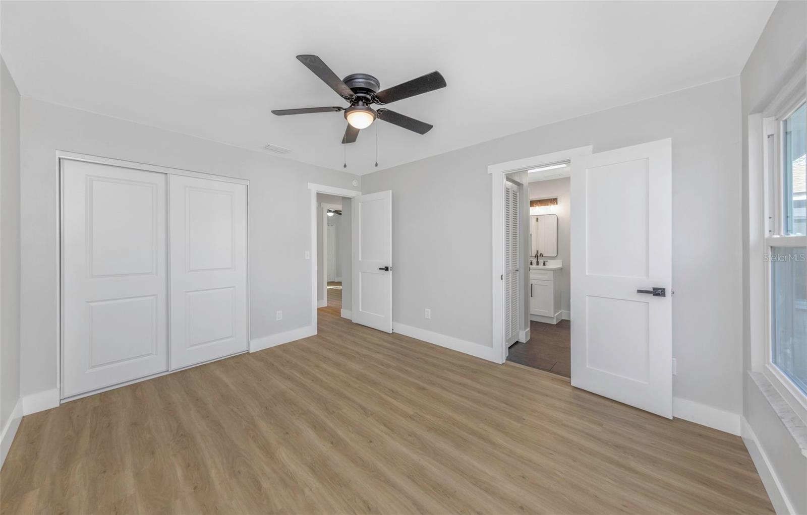 Bedroom #2 with door to 2nd bathroom