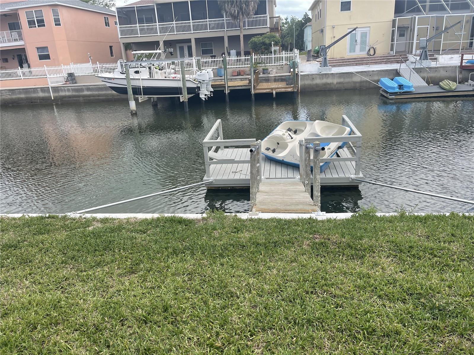 New seawall with floating dock and paddleboat