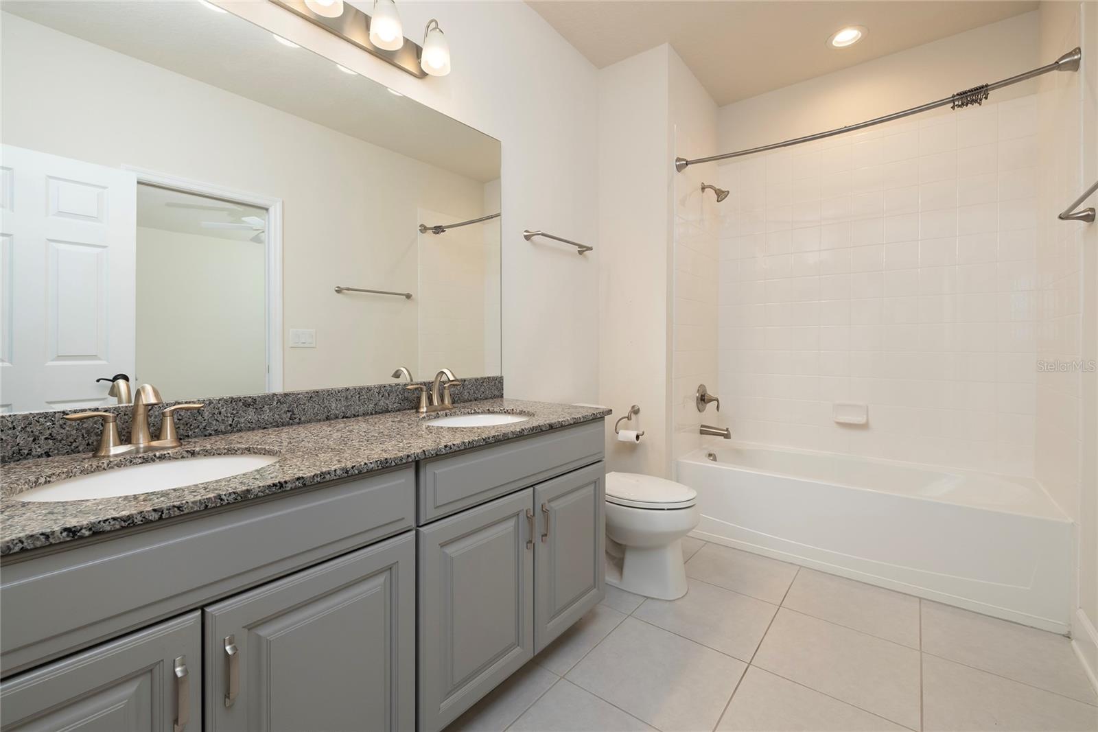 Bathroom next to loft and adjacent to 2nd bedroom