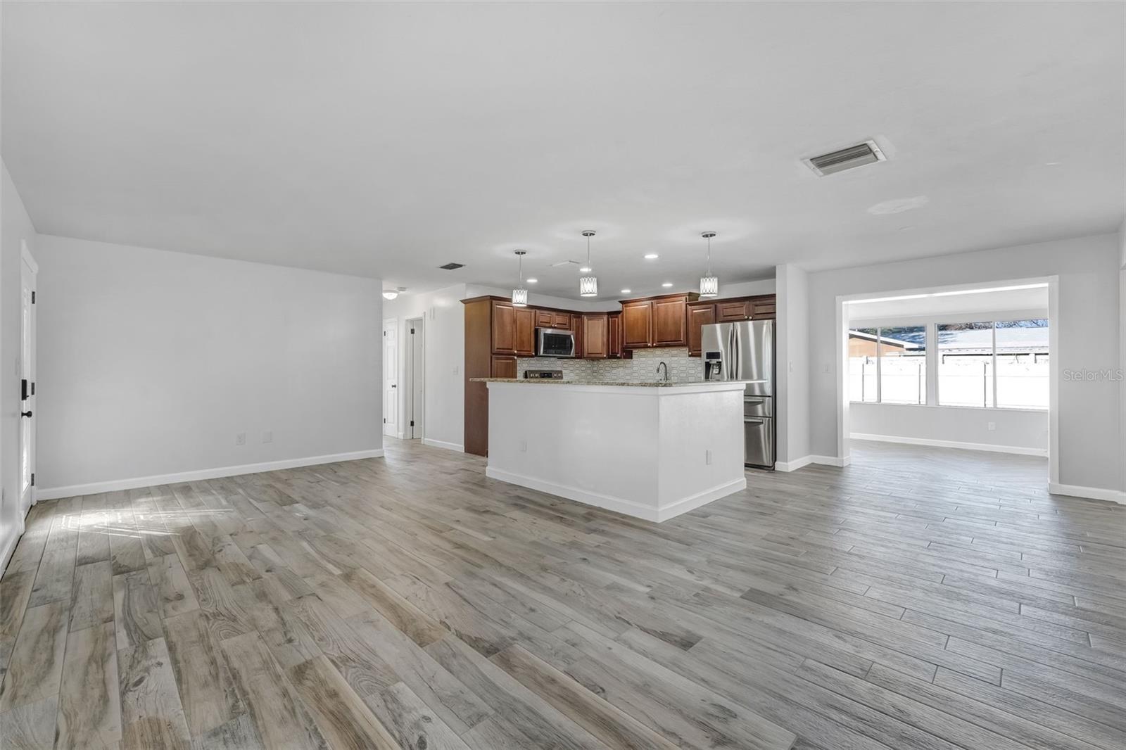 Family Room, Kitchen, Hallway to 2 Bedrooms, and Florida Room
