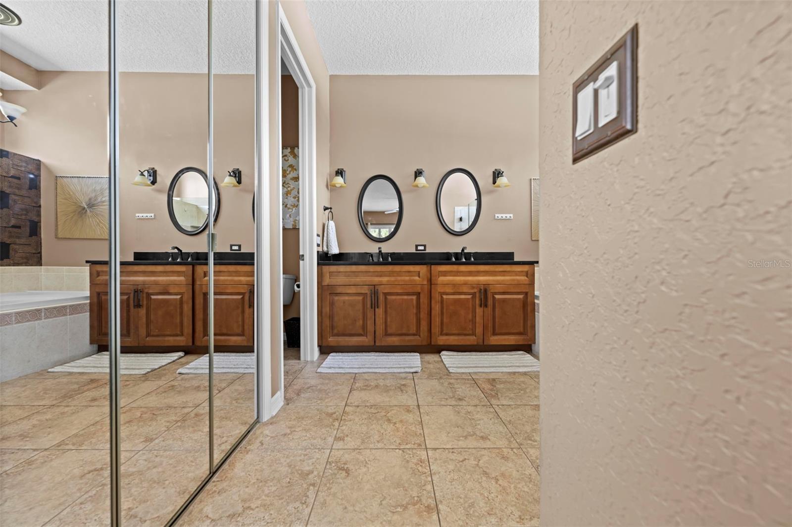 Closets on either side of primary bathroom entry