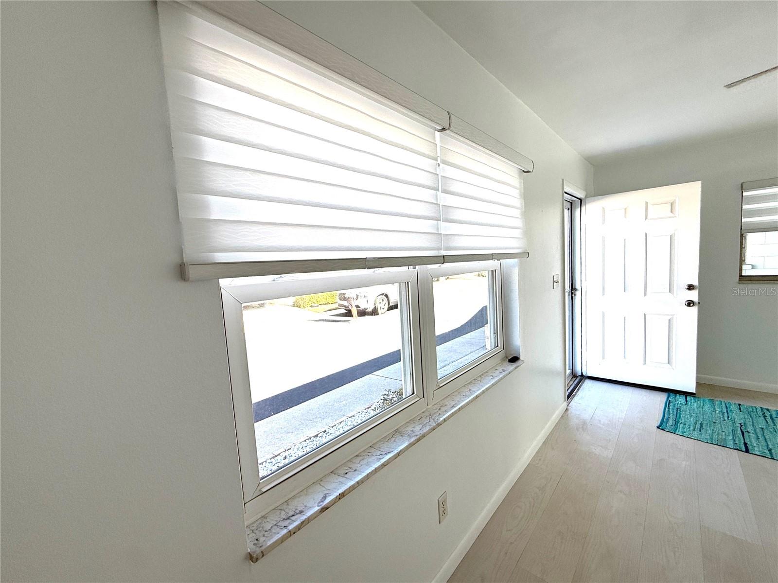 Living room with newer double pane windows and premium Levelor Blinds