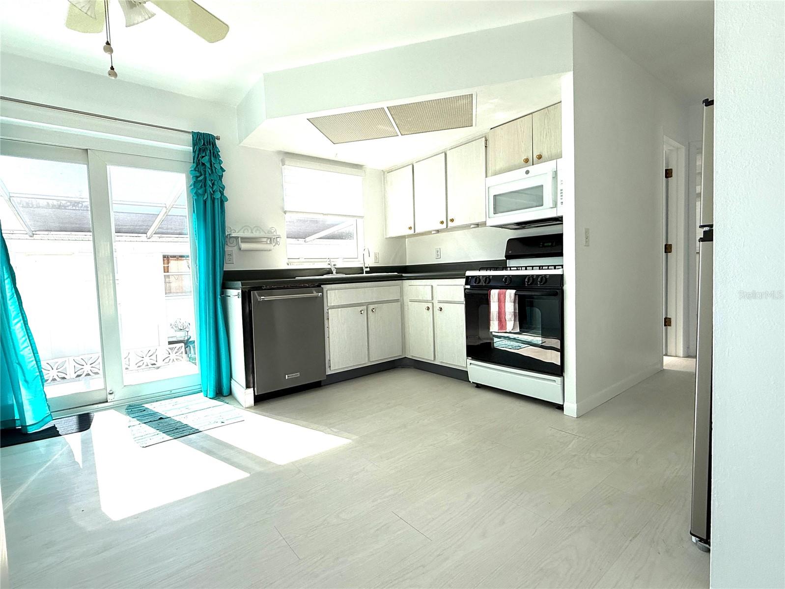 Kitchen and Dining featuring newer double pane sliders