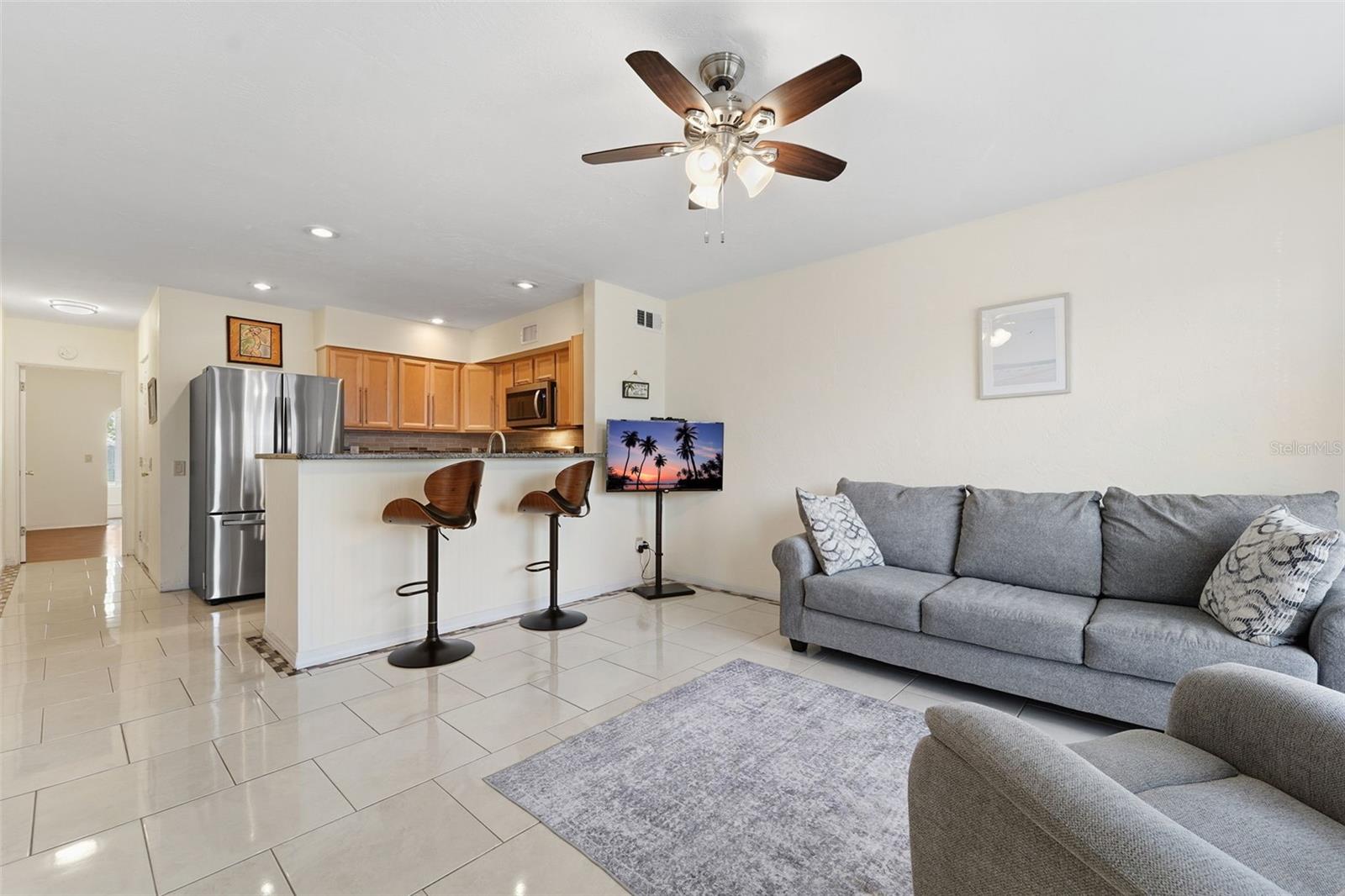 The kitchen features a counter-height dining area that blends function and style, ideal for both dining and entertaining.