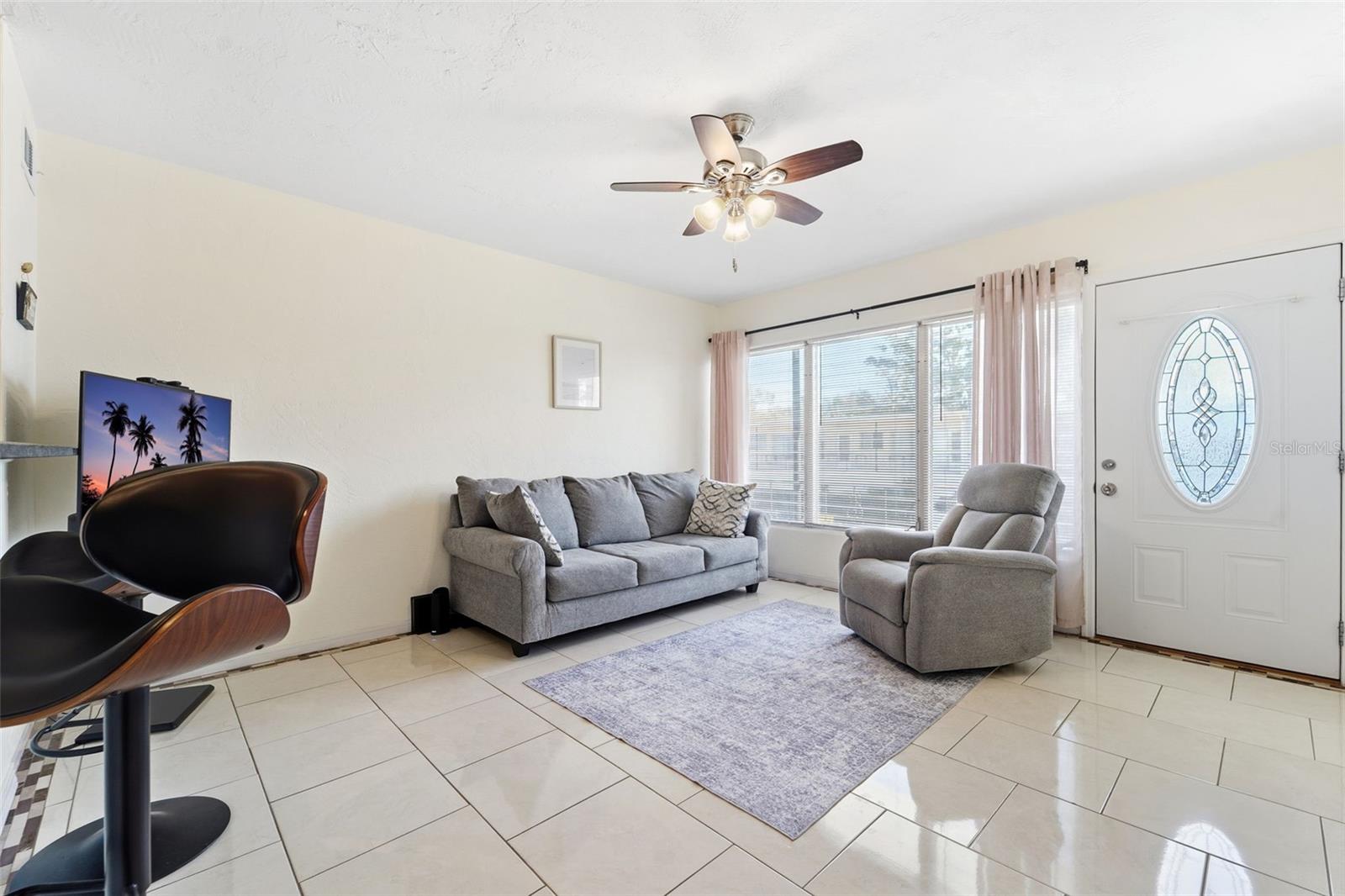 An east-facing living room welcomes abundant morning light.
