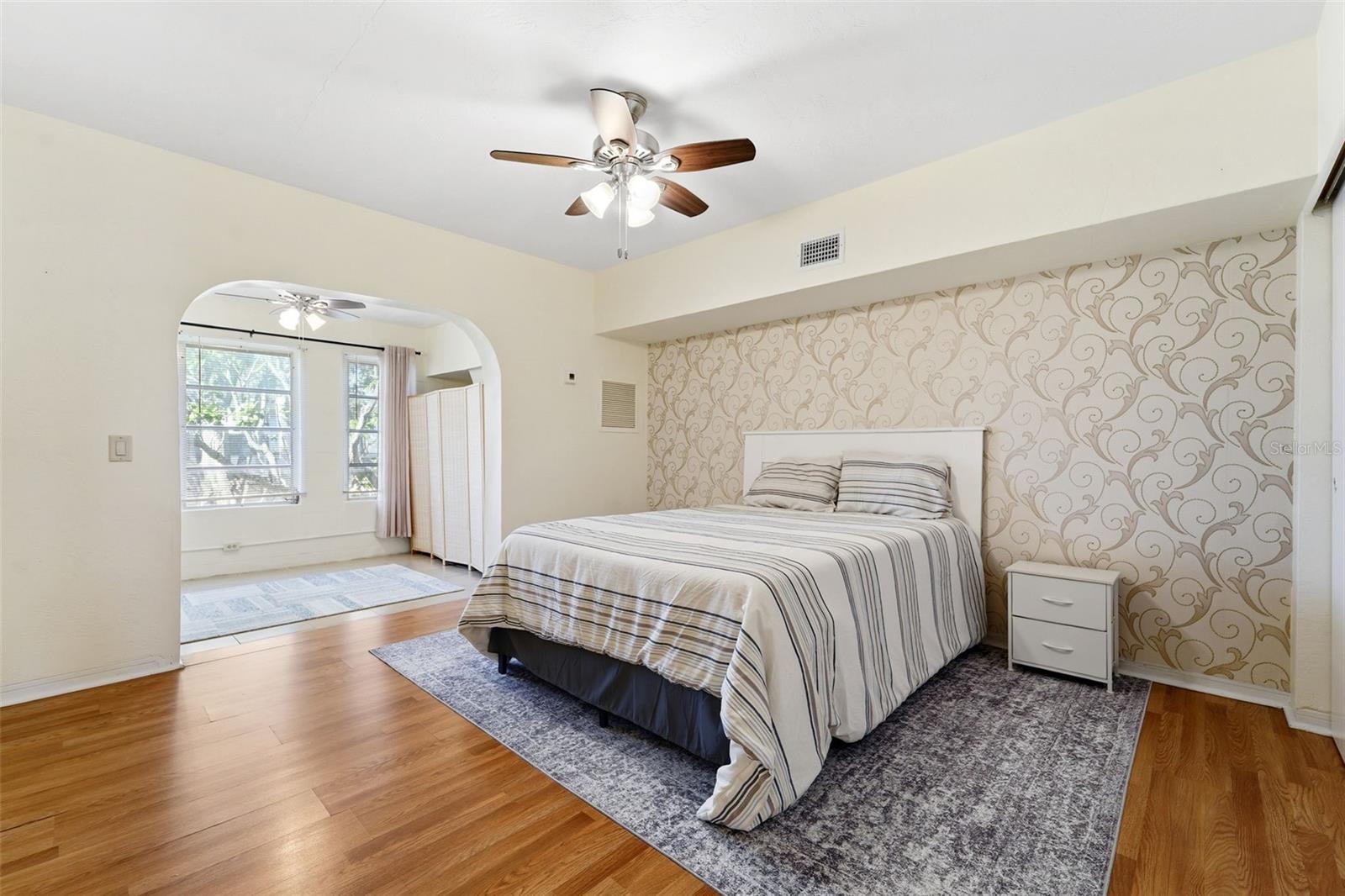 The oversized bedroom easily accommodates additional dressers and includes overhead lighting and a ceiling fan for added comfort.