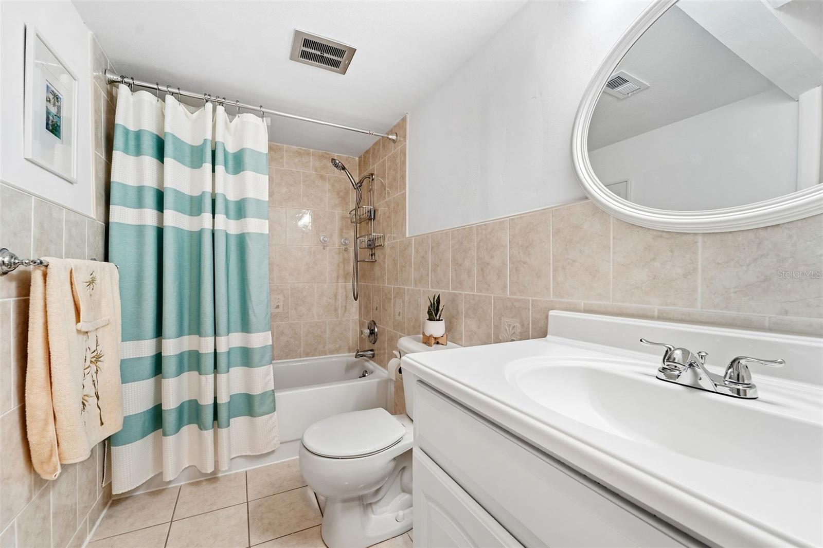 The updated bathroom has been extended to include a storage closet and washer/dryer hookups for a stackable unit, with 110 and 220 outlets, hot and cold water, drain, and vent stack.