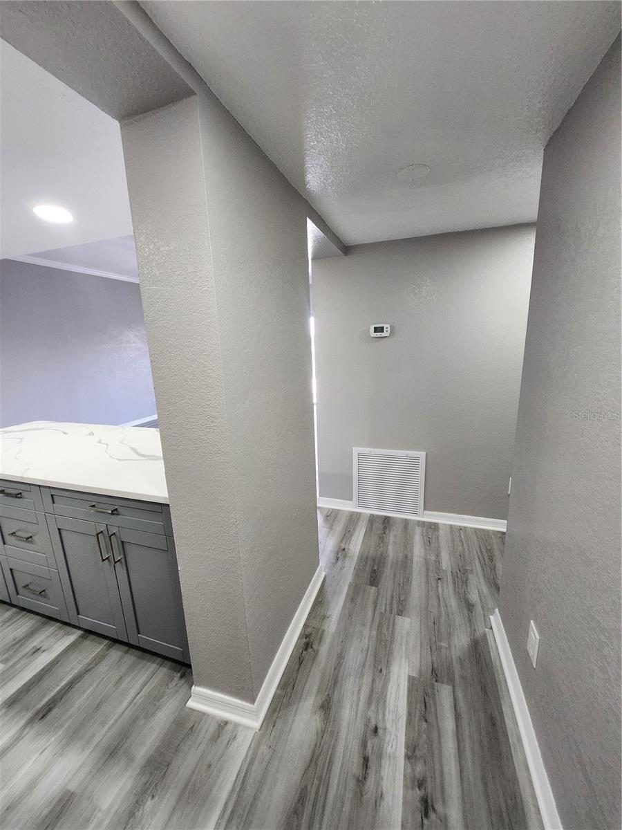 ENTRANCE W KITCHEN ON LEFT. BEDROOMS OFF HALLWAY ON RIGHT