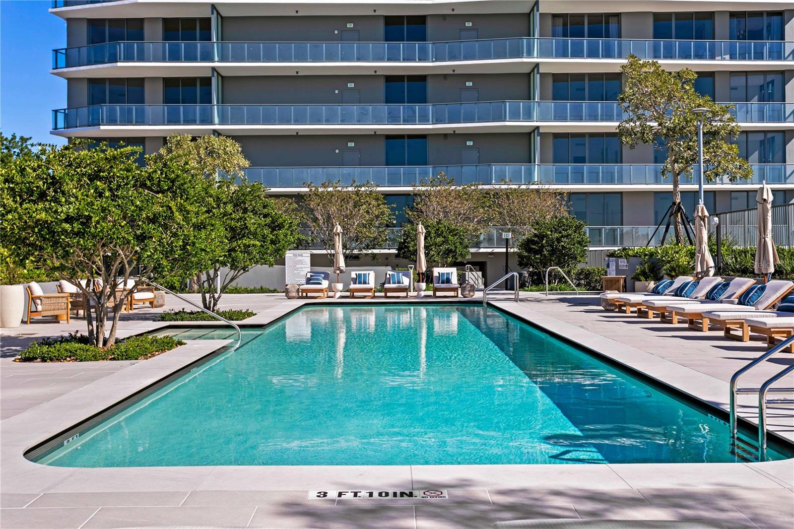 Large amenity deck with swimming pool, spa, and foodand beverage options