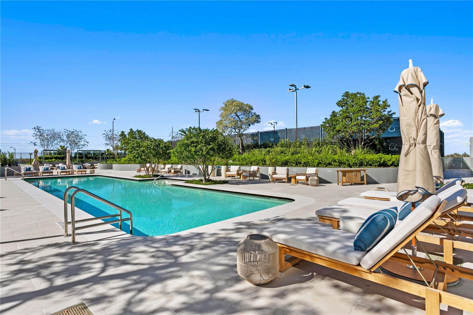 Large amenity deck with swimming pool, spa, and foodand beverage options