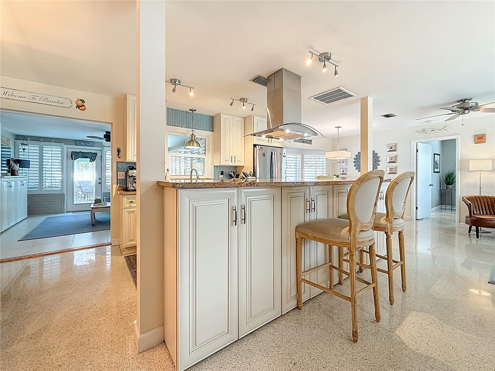 In addition to the large kitchen nook, the island offers additional seating and storage.