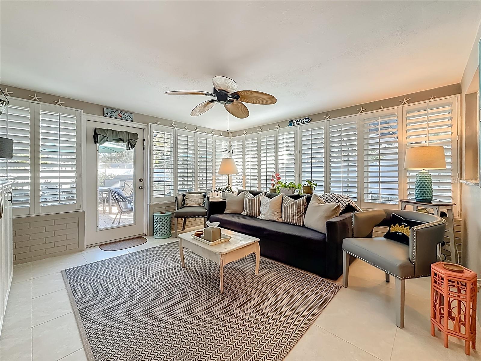 Beautiful bonus Florida room, which looks over the pool area, offers almost 200 sq. ft. of additional living space.
