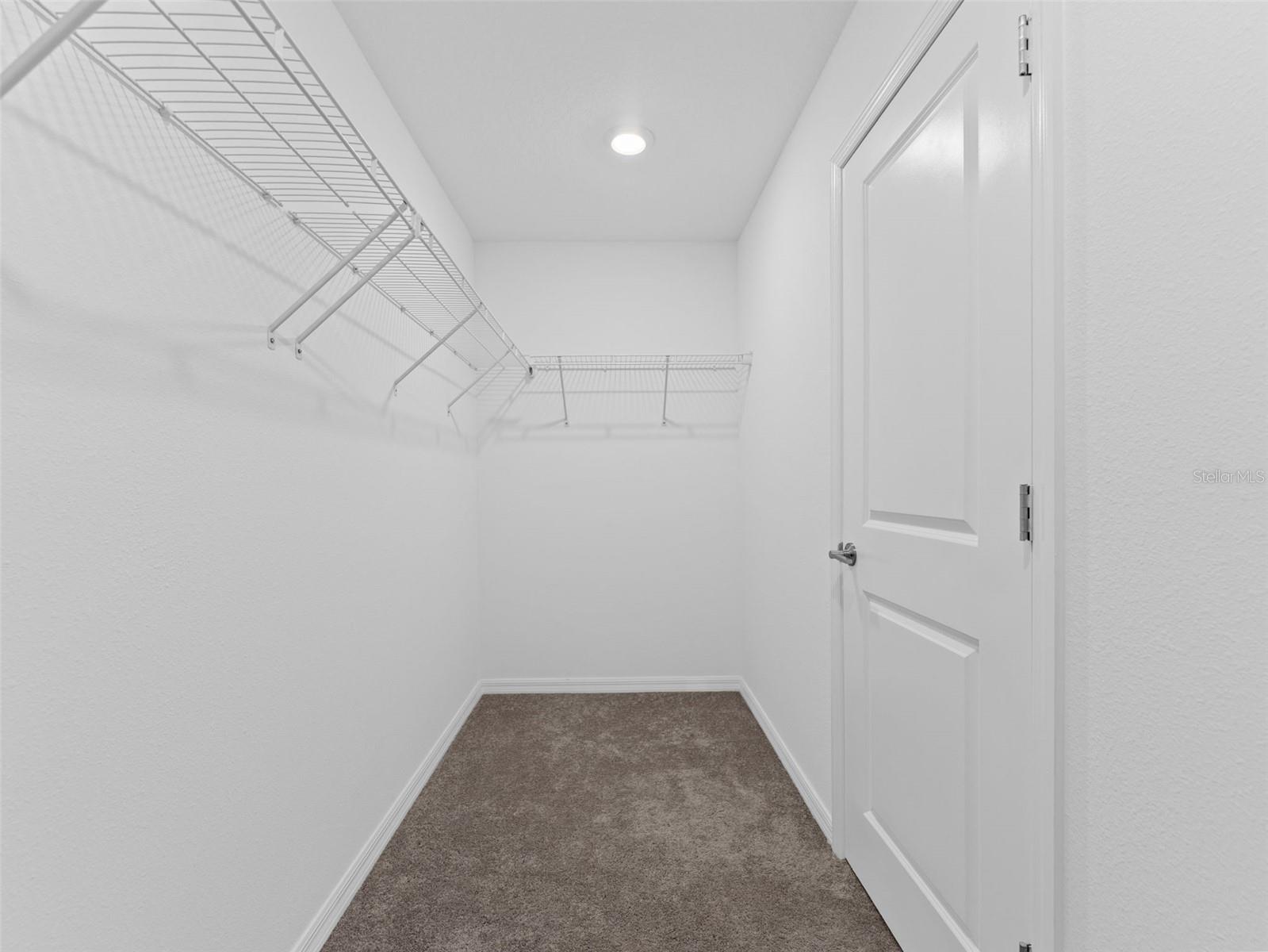 Primary Suite walk in closet