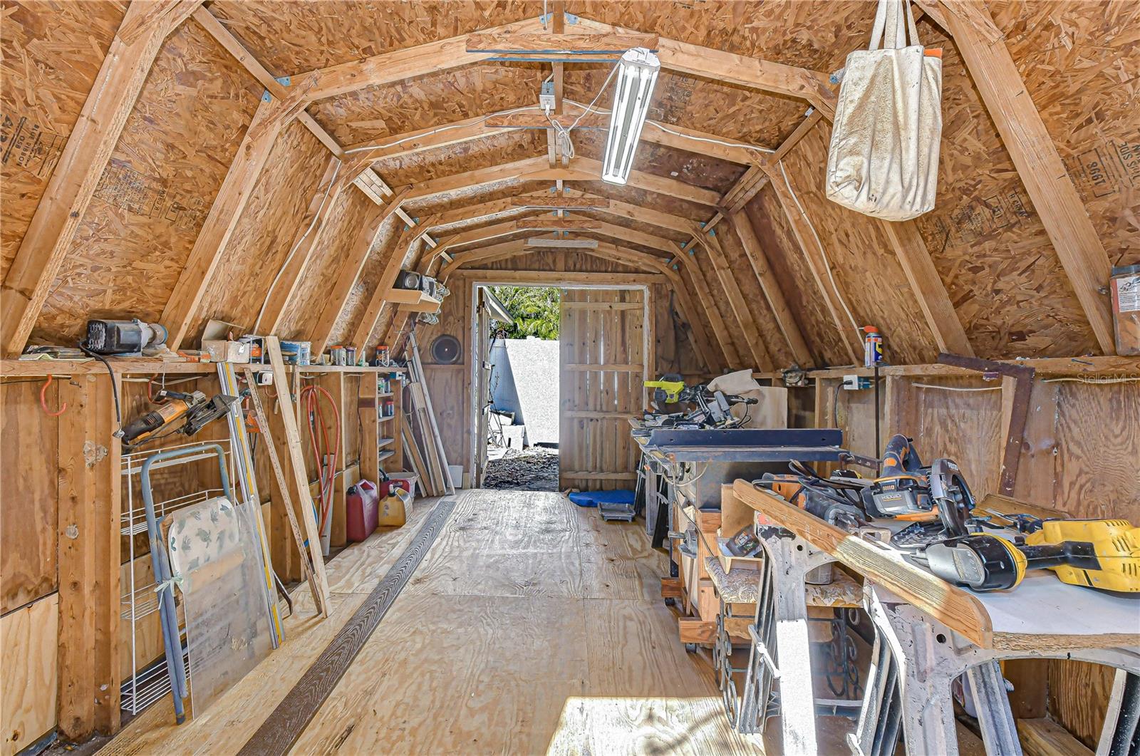 Detached workshop is 180sf with electricity, in ground compressor hose from garage and generator lines from workshop to home.