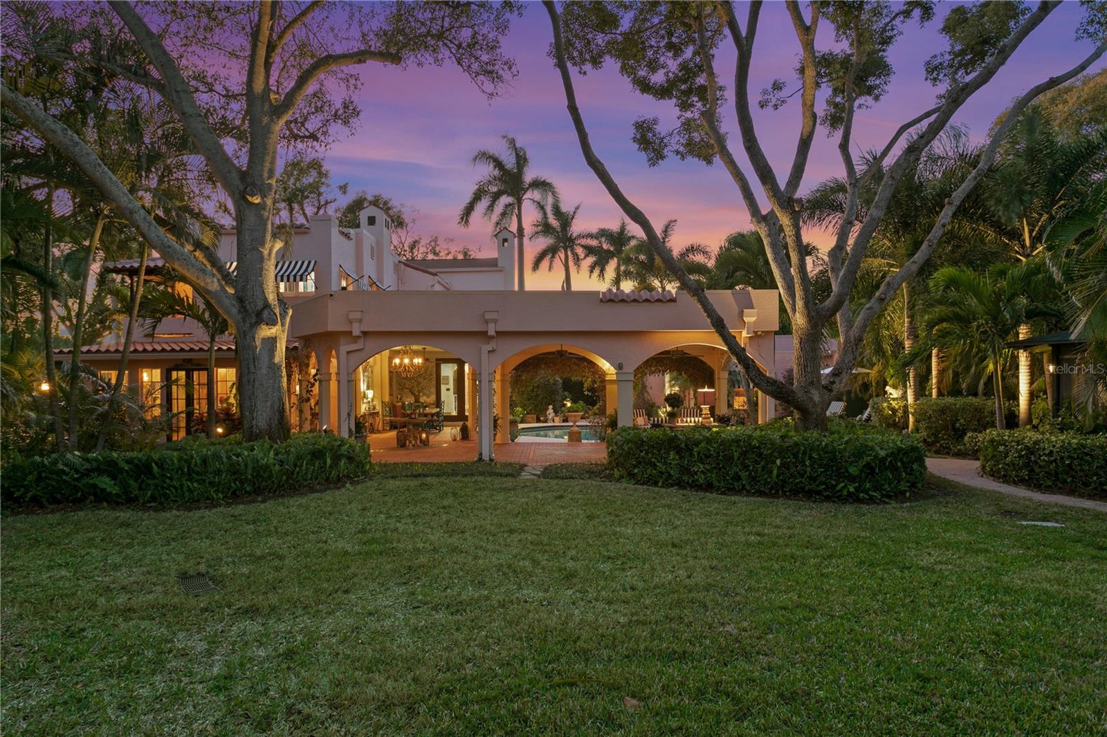 Double lot, corner property with immaculate grounds encompassing .43 of an acre. Not on Flood Zone.