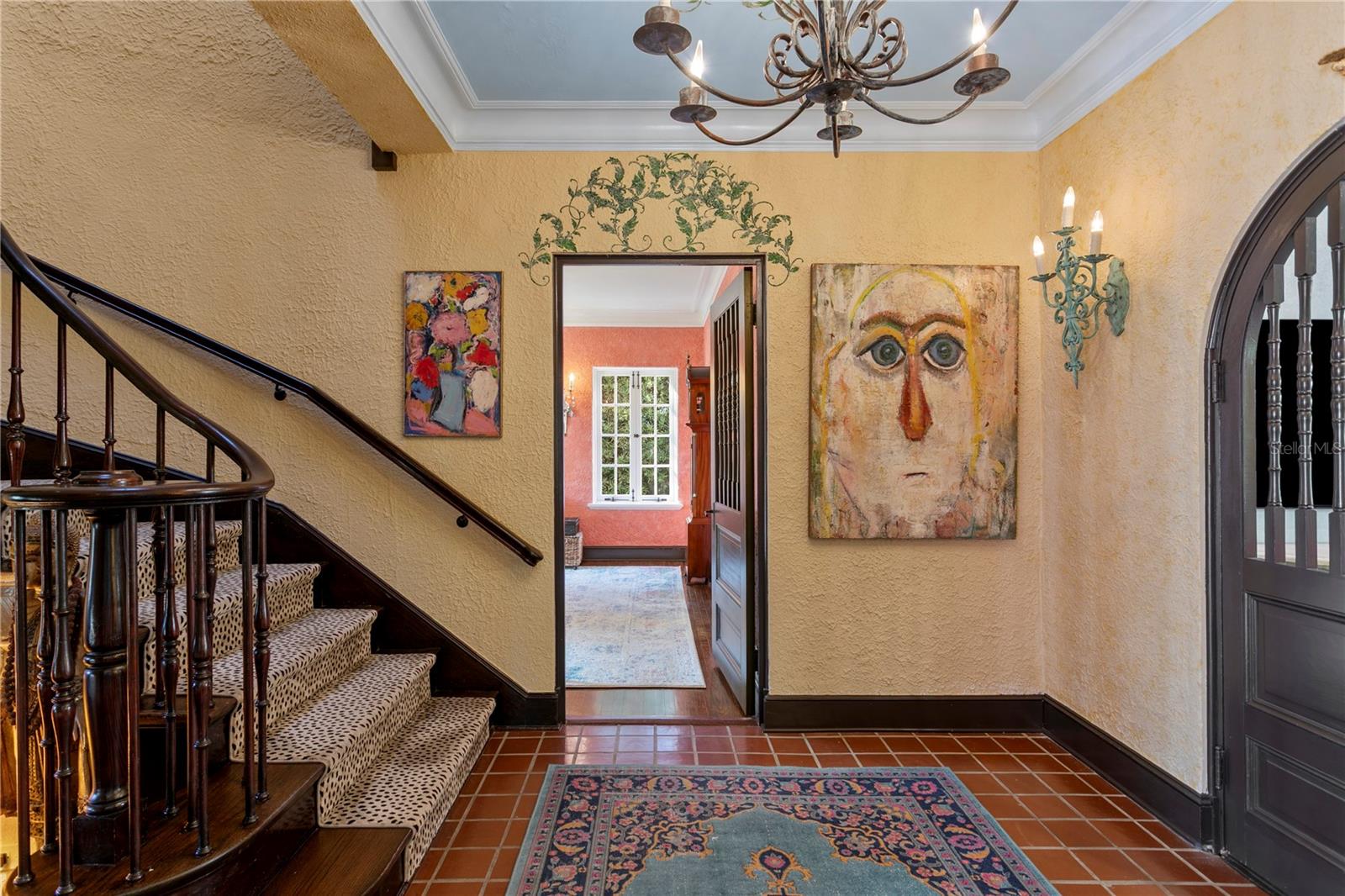 From the Foyer looking towards the Dining Room, notice the curved doors towards the Parlor on the right.