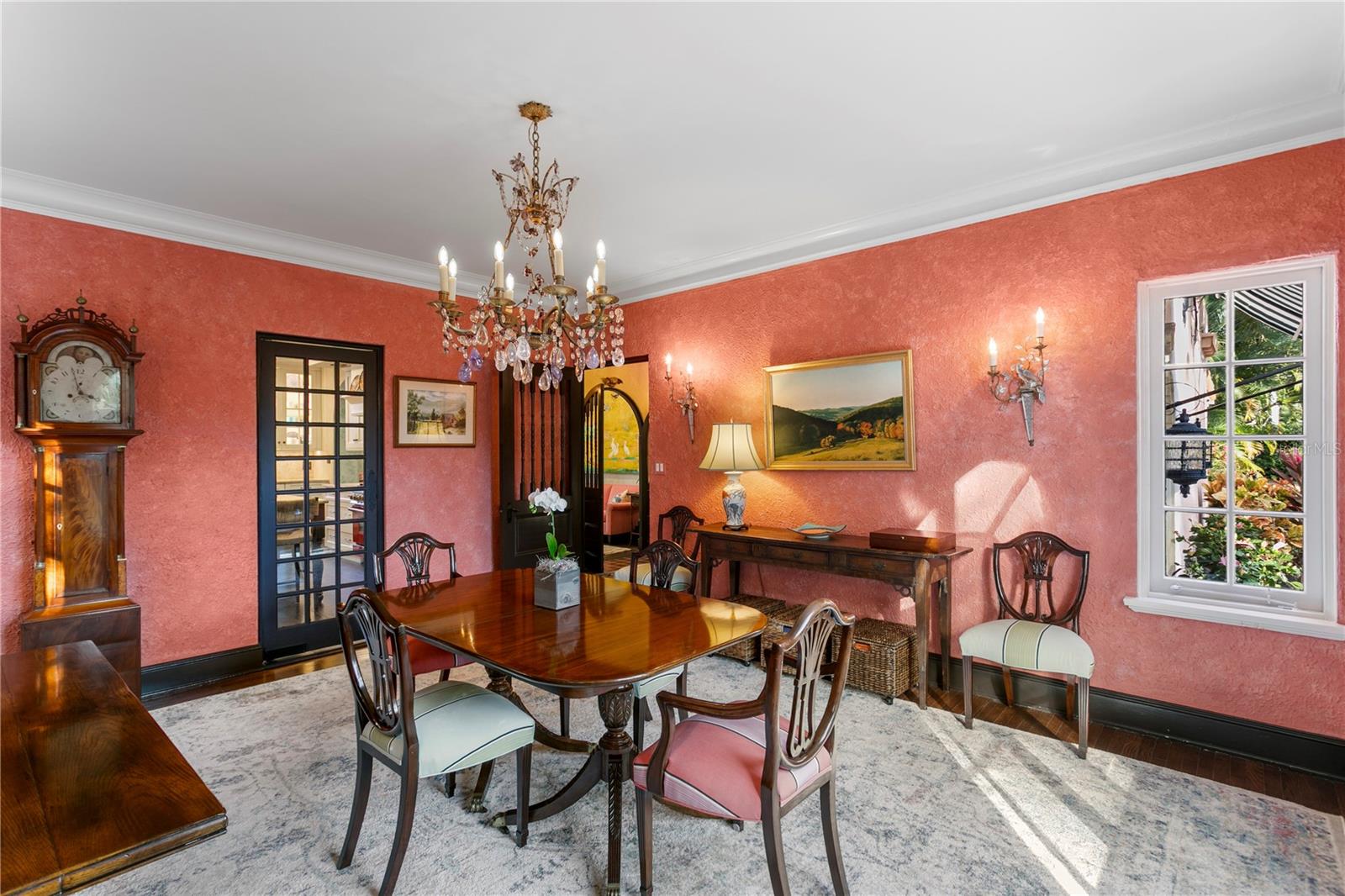 Original crown moldings, baseboards, and flooring throughout.