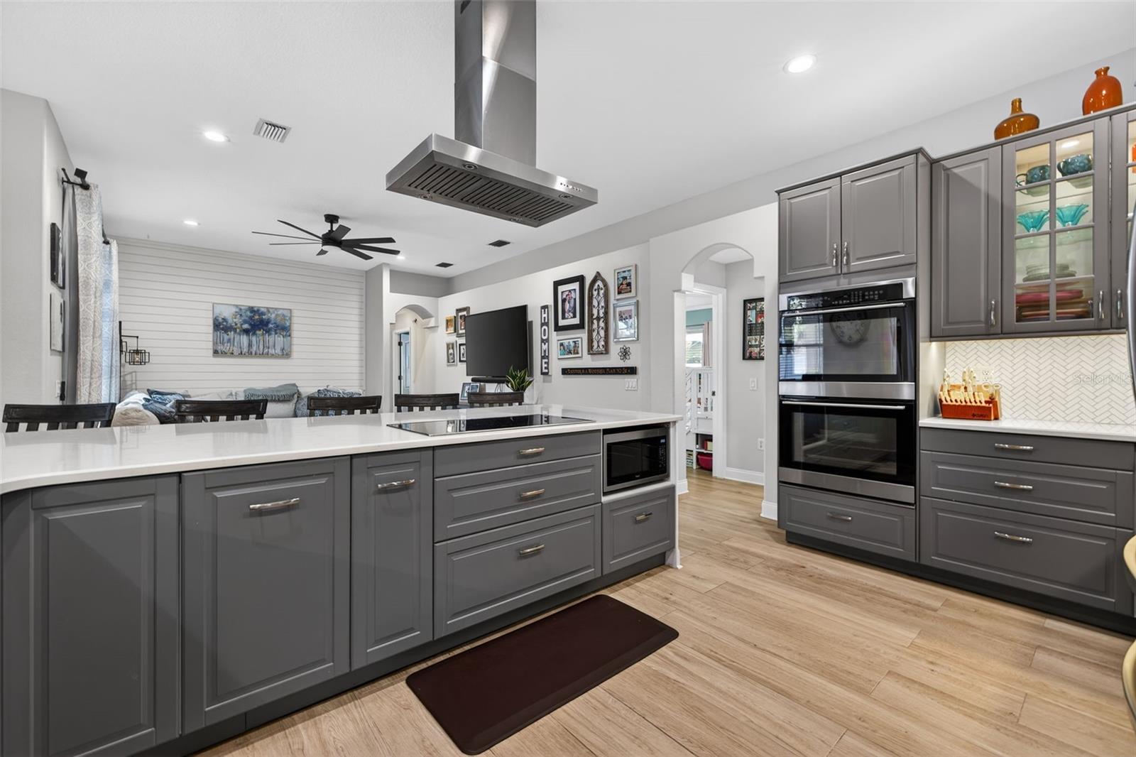 Kitchen with updated gray cabinetry throughout