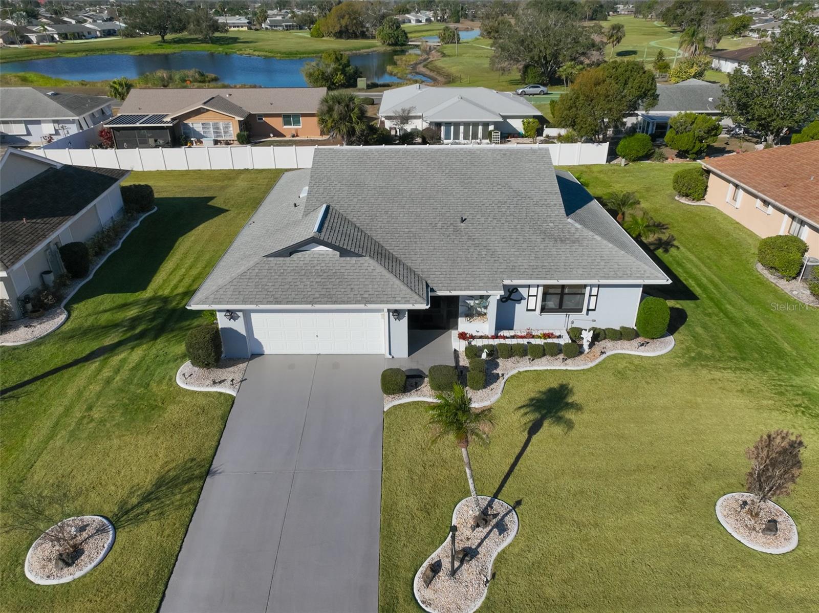 Quarter acre lot, beautifully landscaped with custom curbing and solar landscape lights. Notice the distance between the homes.